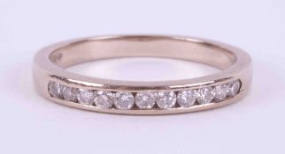 An 18ct white gold half eternity ring set with approx. 0.16 carats total weight of round brilliant