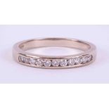 An 18ct white gold half eternity ring set with approx. 0.16 carats total weight of round brilliant