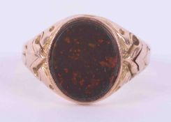 A 9ct yellow gold signet ring set with an oval bloodstone, measuring approx. 12mm x 10mm, 2.67g,