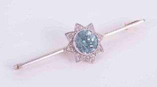 A 15ct yellow & white gold bar brooch set with approx. 2.43 carats of round cut blue zircon and