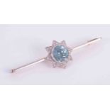 A 15ct yellow & white gold bar brooch set with approx. 2.43 carats of round cut blue zircon and