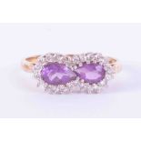 A 9ct yellow & white gold cluster ring set two pear shaped amethysts weight approx. 0.85 carats