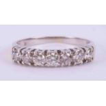 A 9ct white gold seven stone half eternity ring set with approx. 0.42 carats total weight of round