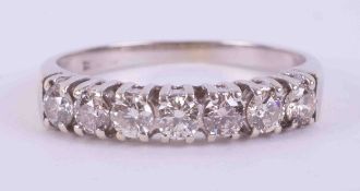 A 9ct white gold seven stone half eternity ring set with approx. 0.42 carats total weight of round