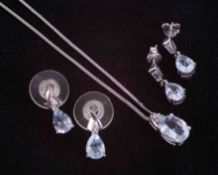 A set comprising of a 9ct white gold pendant set with an oval aquamarine approx. 1.46 carats with