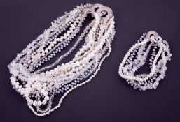 A designer set comprising of a black & white pearl, moonstone & crystal bead multi-strand necklace