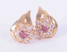 A pair of 9ct yellow gold leaf & flower design earrings set approx. 0.12 carats of ruby (total