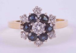 An 18ct yellow & white gold flower cluster ring set with seven round brilliant cut diamonds, total