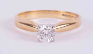 An 18ct yellow & white gold four claw solitaire ring set with 0.42 carats of round brilliant cut