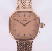 Omega, a ladies vintage 9ct yellow gold Quartz wristwatch with hexagonal shaped face, herringbone