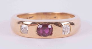 An 18ct yellow gold (not hallmarked or tested) ring set with two old mine cut diamonds,