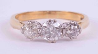 An 18ct yellow & white gold three stone ring set with approx. 1.50 carats total weight of old