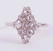 A platinum marquise shaped ring set with approx. total weight 1.55 carats of old round cut diamonds,