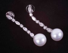 A pair of impressive 18ct white gold drop earrings set with two white South Sea pearls measuring