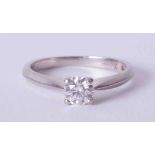 A four claw platinum solitaire ring set approx. 0.45 carat round brilliant cut diamond, colour D-E