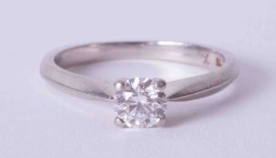 A four claw platinum solitaire ring set approx. 0.45 carat round brilliant cut diamond, colour D-E