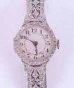An antique 18ct white gold ladies cocktail watch ornately set with diamonds with an 18ct white