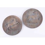 A pair of heavy bronze historical Lloyds Bank circular wall plaques, depicting the horse logo with a