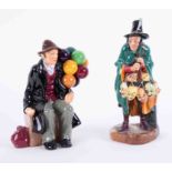 A Royal Doulton 'The Balloon Man', HN1954 together with 'The Mask Seller', HN2103 (2).