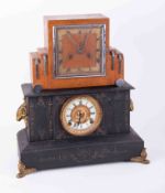 A Victorian black and gilt mantle clock together with an Art Deco style oak cased mantle clock (2).