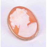 A 9ct gold cameo brooch set with double twist wire decoration.