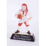 A Carlton Ware brewery china figure, "Pick Flowers Brewmaster", height 25cm.