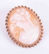 A 9ct gold cameo brooch with twisted wire decoration.