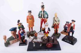 A collection of various pub advertising figures, plastic and composition to include Coronetti figure