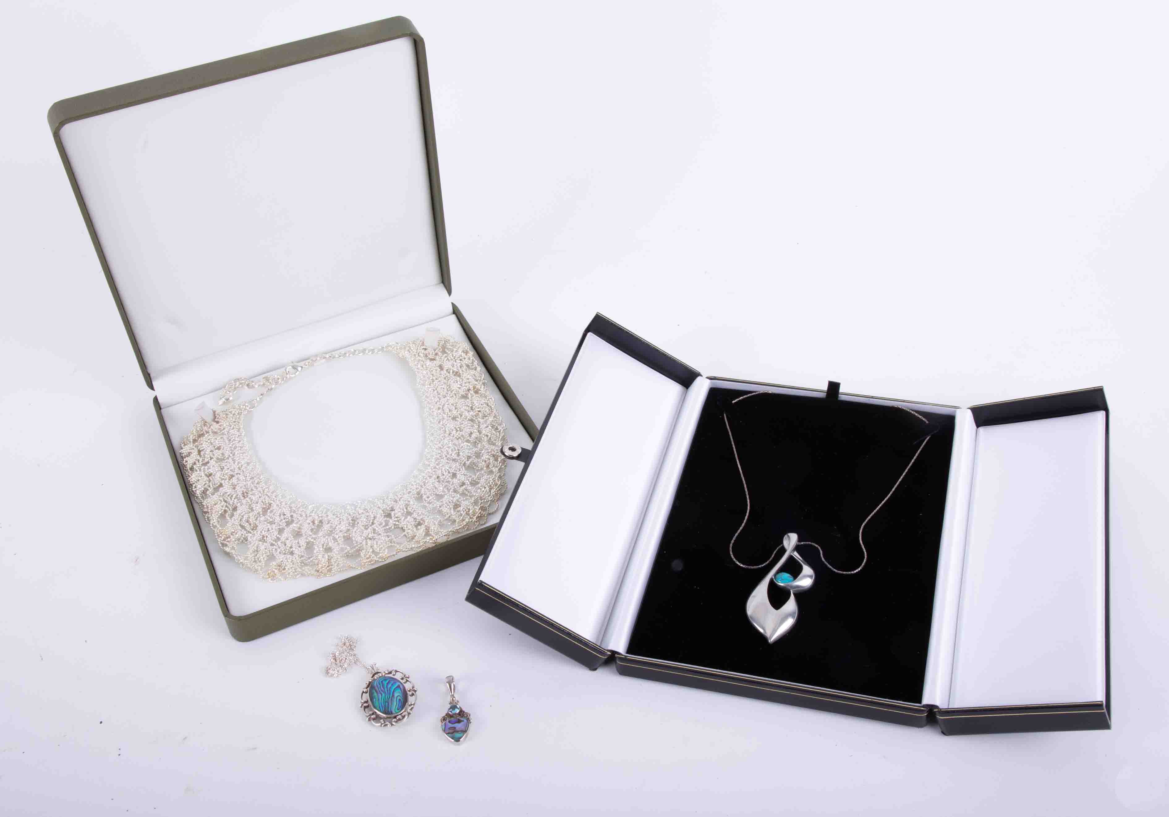 Modern silver pendants, a contemporary silver effect and turquoise pendant/necklace on fine chain