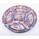 A modern Imari sectional serving dish, on lazy Susan, diameter 38cm on revolving tray.