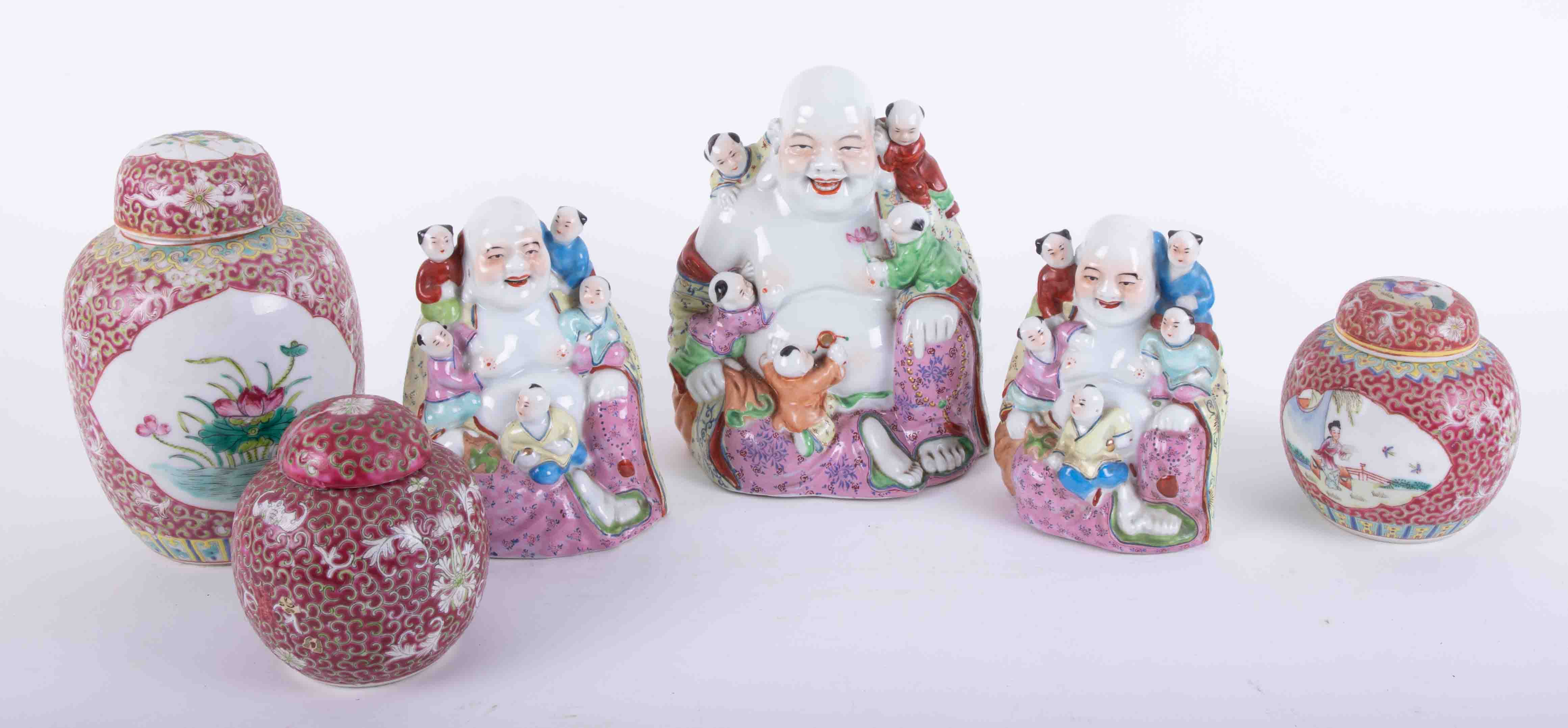 Three reproduction Chinese porcelain "Buddha Boys", figures, together with three ginger jars.