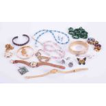 A bag of various costume jewellery, including bangles, bracelets Lorus and other ladies watches.