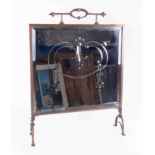 An Antique mirror fronted and etched brass fire screen.