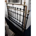 An antique brass and iron metal bed frame, height head frame 133cm and width of head frame 120cm.