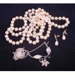 Faux pearl necklace and earrings together with silver moonstone necklace.