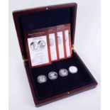 Four silver proof crowns, Roses of British Royalty with mahogany case.