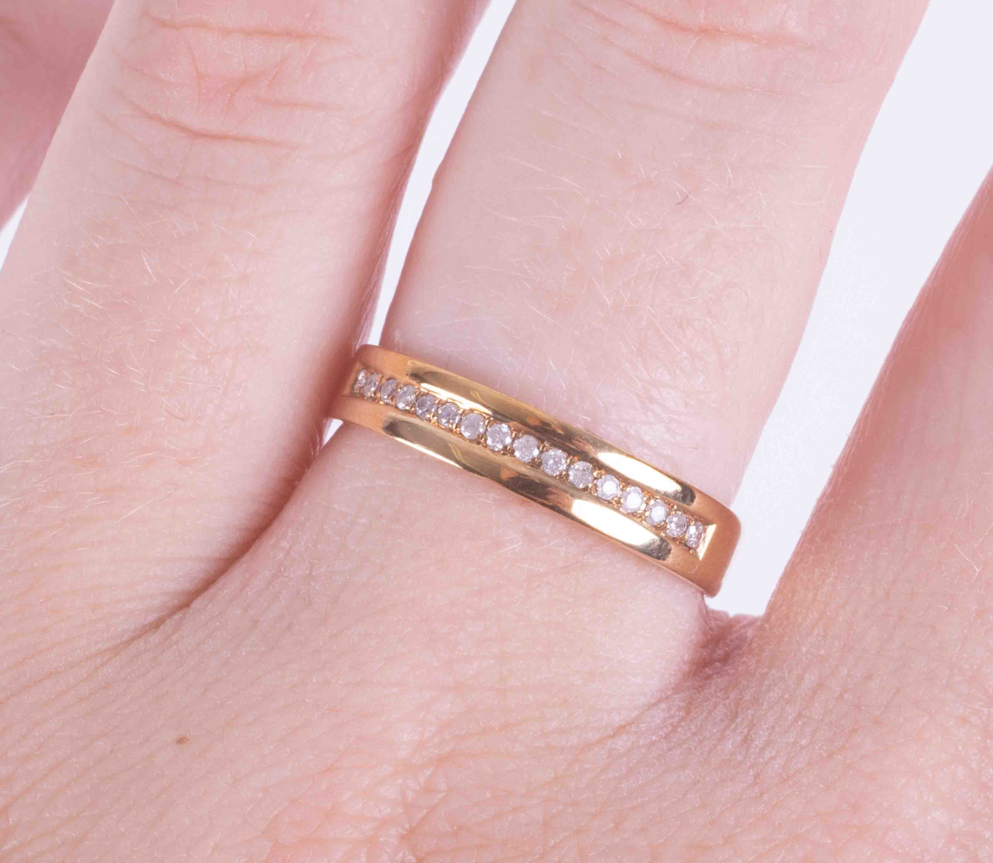 A 9ct yellow gold half eternity style ring set with 0.10 carats (total weight) of round brilliant - Image 2 of 2