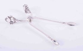 Silver, a pair of sugar tongs, stamped sterling, Denmark, Georg Jensen, possibly 1930's?