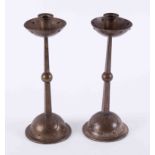 A pair of Arts & Crafts metal candlesticks, height 26cm.