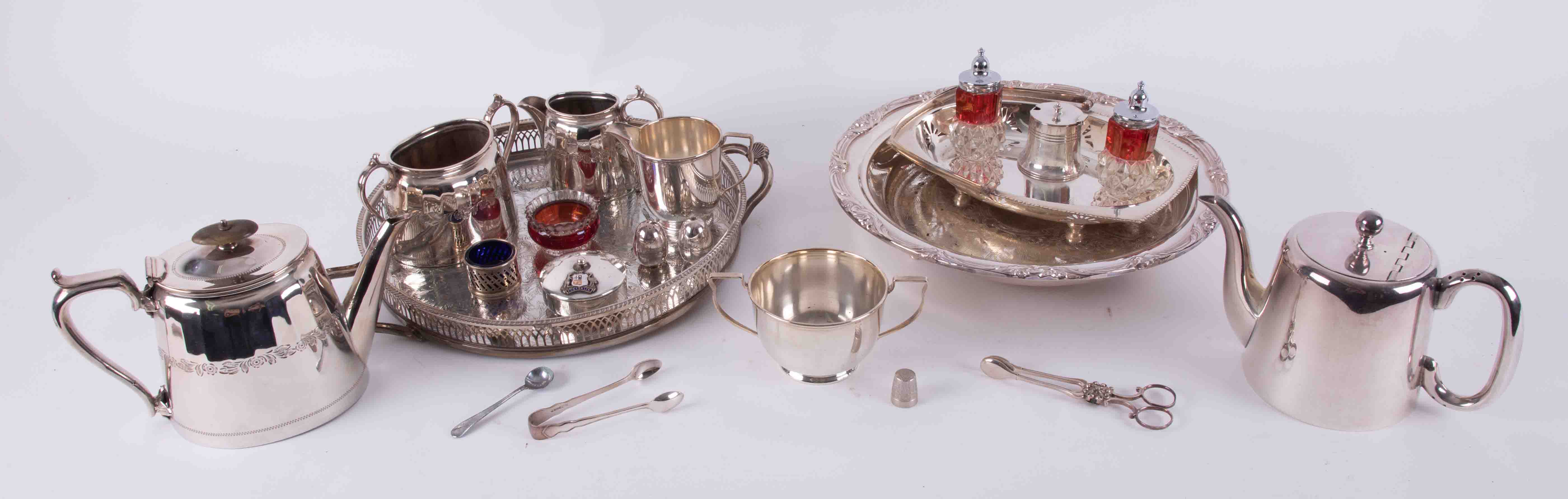 A collection of various silver plated tea wares, trays, Australia enamelled box, condiments, sugar