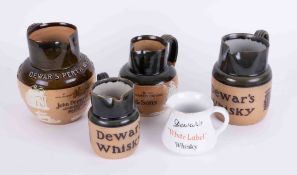 Four Royal Doulton Dewar's Whisky pub jugs including Perth Whisky, also a Minton's Dewar's jug (5).