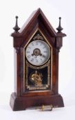 A Victorian rosewood Jerome steeple clock with bell strike.