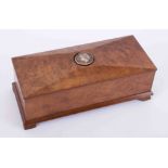A 20th Century burr walnut box with carved portrait set in the lid, length 25cm.