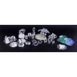 A collection of Swarovski, twenty three containers of crystal glass including dolphins, seahorse,