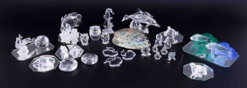 A collection of Swarovski, twenty three containers of crystal glass including dolphins, seahorse,