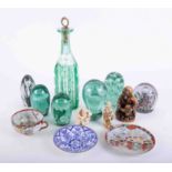 A mixed collection of coloured glass including paperweights, also some Oriental carvings and