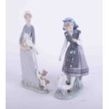 Lladro, girl with geese, No 5.202, boxed, together with another similar (2), the tallest 30cm.