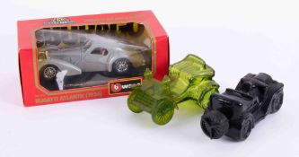 A collection of boxed model cars including Burago, Polistil, Novelty car bottles, pictures etc.