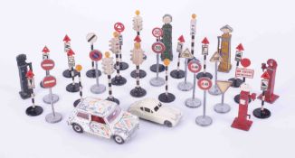 A mixed collection of lead traffic light system, petrol pump also Dinky Toys mini Minor model car