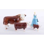 Beswick, two bulls and a large Nelson pottery bull together with a Royal Doulton Disney Princess,